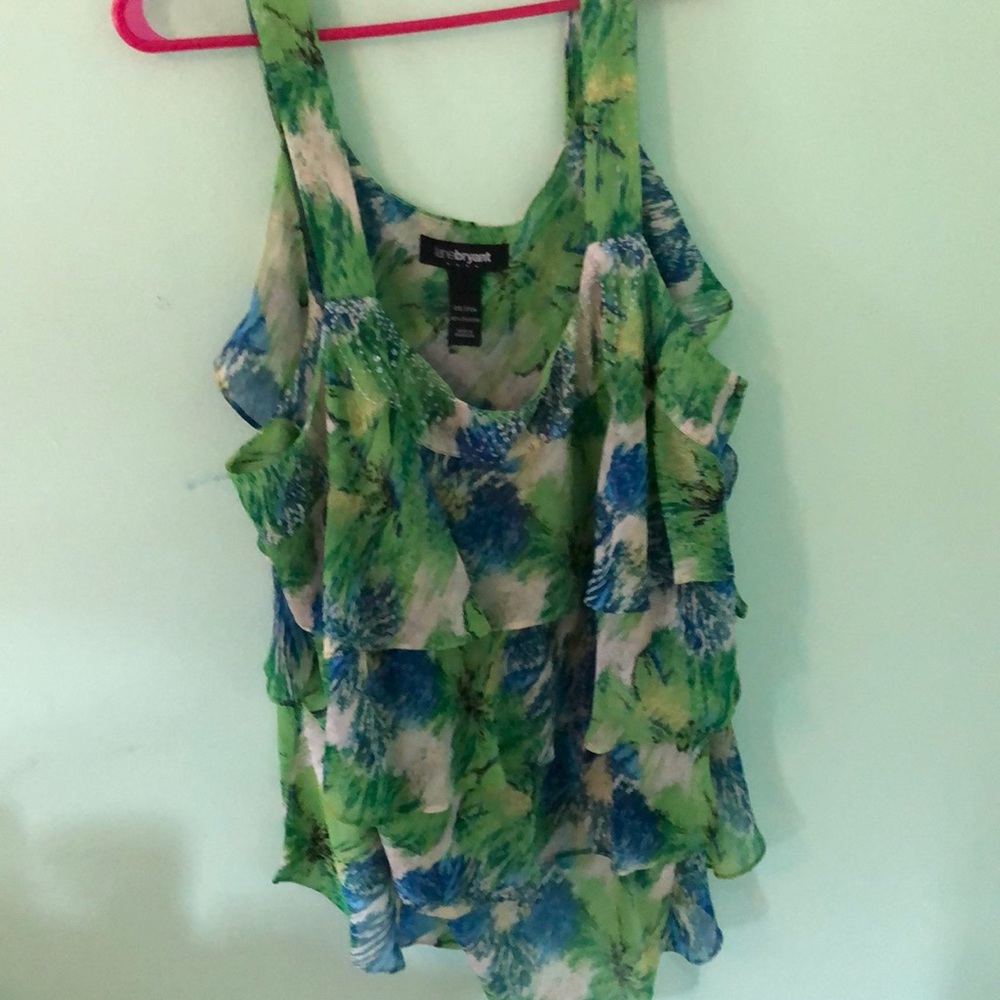 Green with blue patterned blouse.